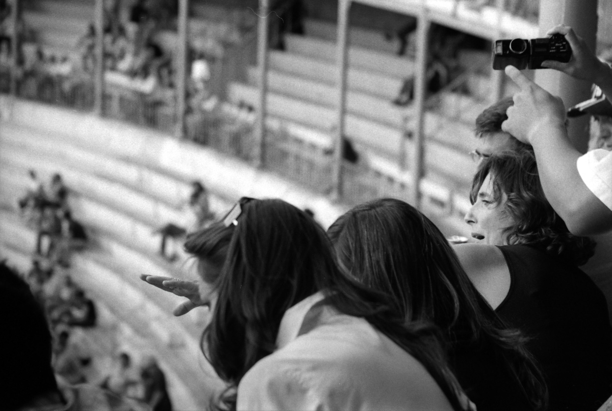 People sitting in the stands of the bullfighting arena.